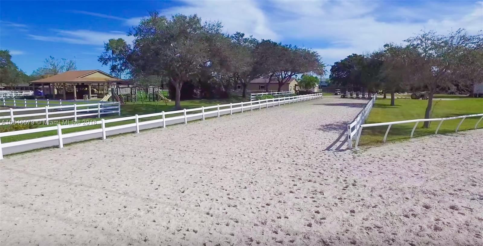 15990 Griffin Road Southwest Ranches, FL 33331 - Photo 18 of 20 a view of a playground with basketball court