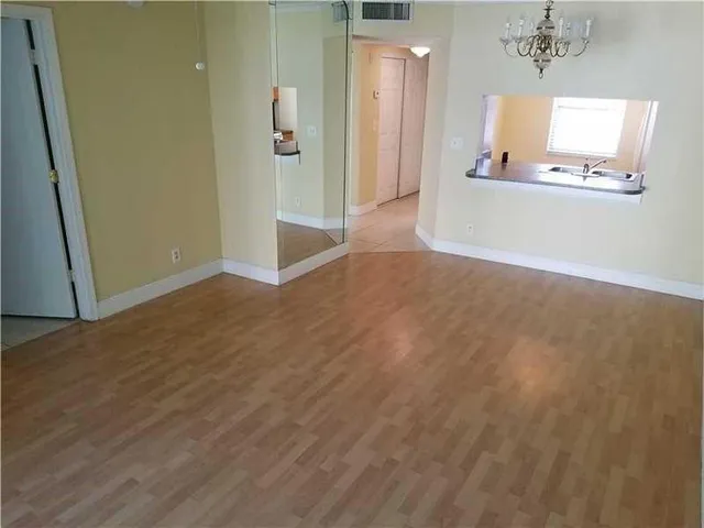 a bathroom with a shower and a mirror