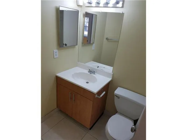 a kitchen with a stove microwave and refrigerator