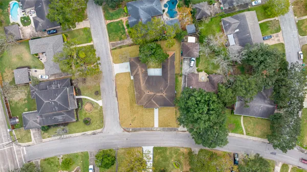 an aerial view of a house with swimming pool