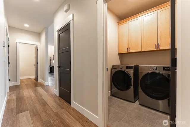 a view of a hallway with washer and dryer