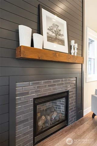 a fireplace with a vase on top of it