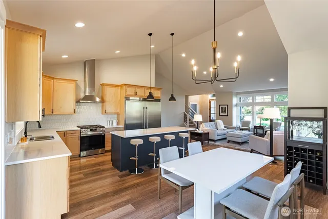 a large kitchen with a table and chairs