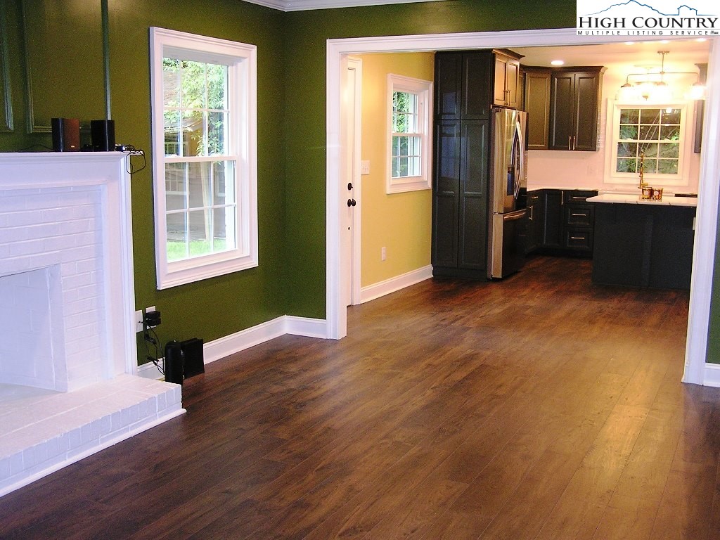 384 New River Heights Road Boone, NC 28607 - Photo 13 of 45 wooden floor in an empty room with a window