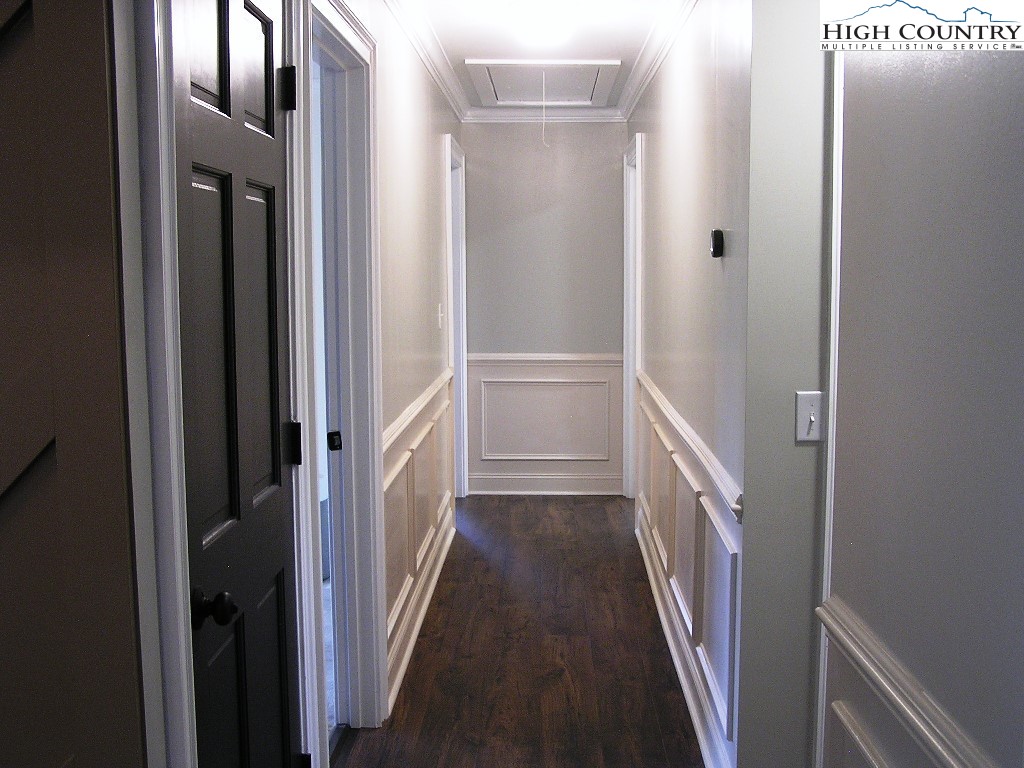 384 New River Heights Road Boone, NC 28607 - Photo 16 of 45 a view of a hallway with wooden floor and entryway