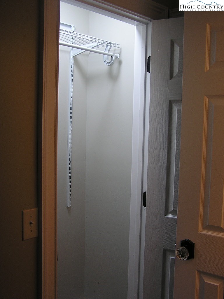 384 New River Heights Road Boone, NC 28607 - Photo 17 of 45 a bathroom with a glass shower door