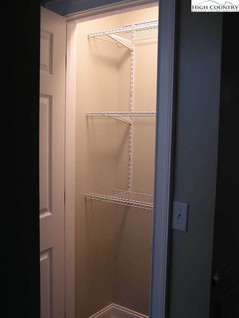 384 New River Heights Road Boone, NC 28607 - Photo 18 of 45 a bathroom with a glass shower door