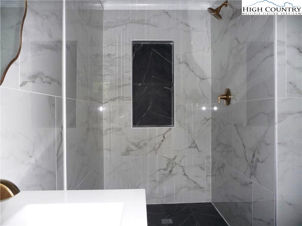 384 New River Heights Road Boone, NC 28607 - Photo 28 of 45 a bathroom with a shower