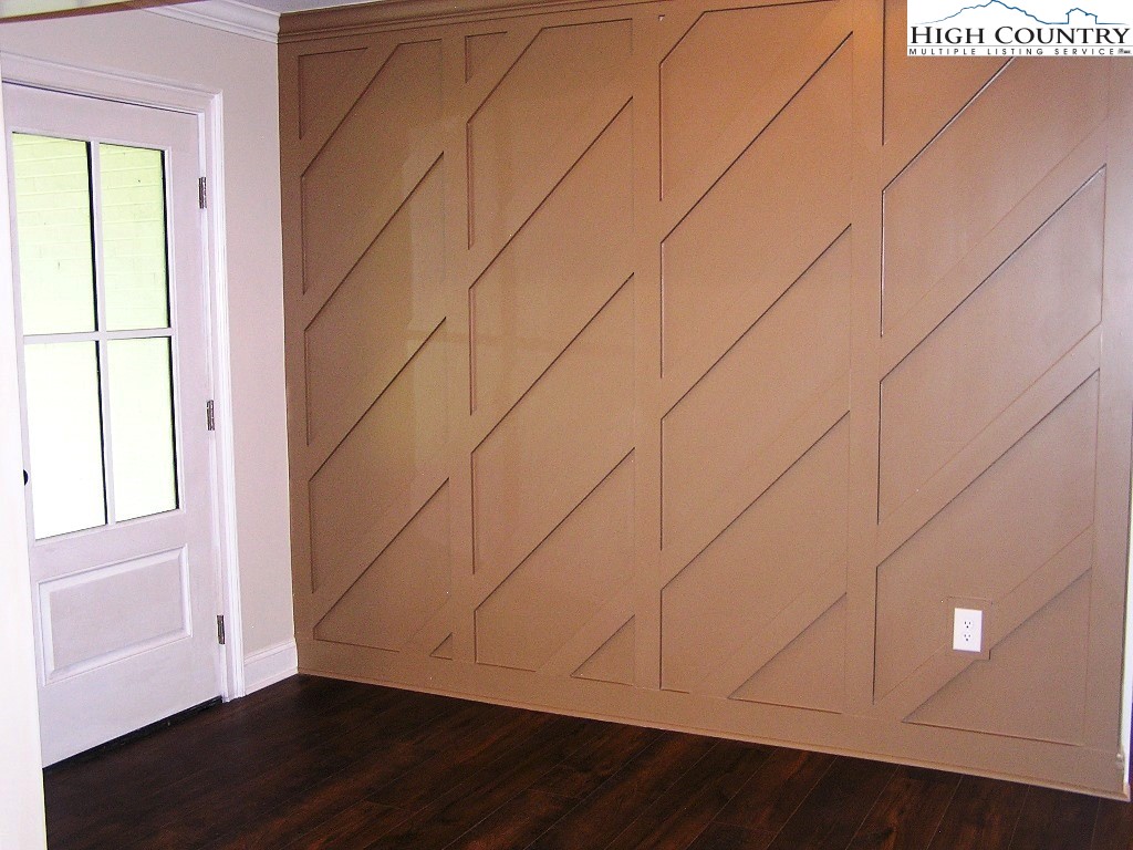 384 New River Heights Road Boone, NC 28607 - Photo 3 of 45 a view of room with window and wooden floor