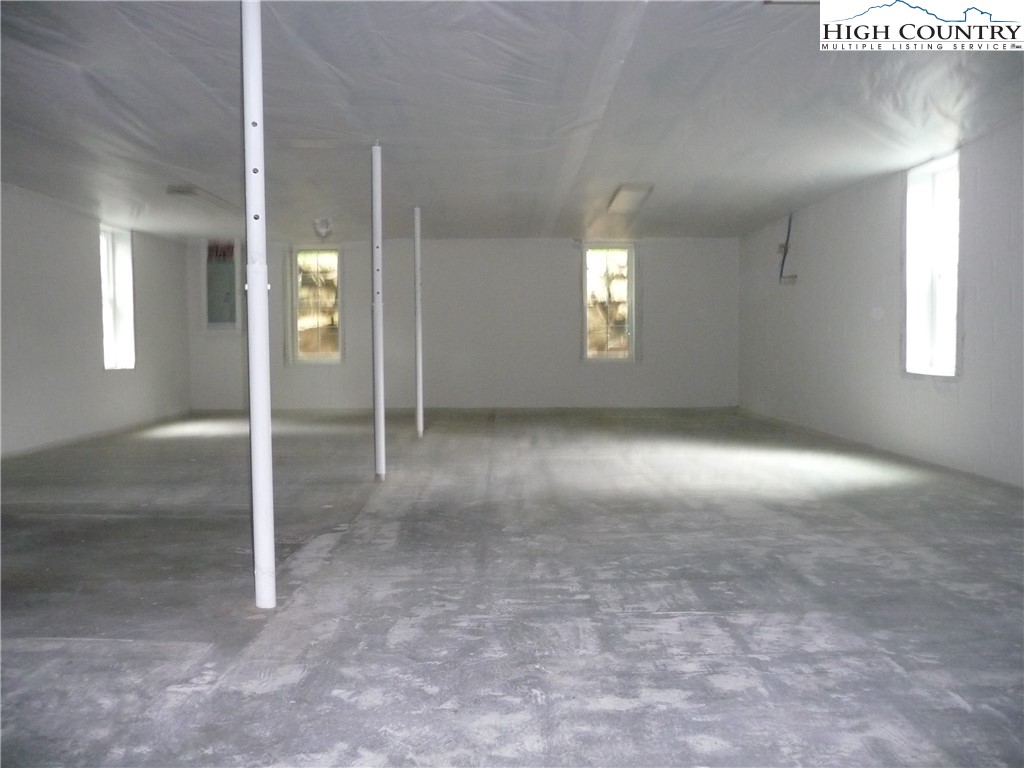 384 New River Heights Road Boone, NC 28607 - Photo 34 of 45 an empty room with windows