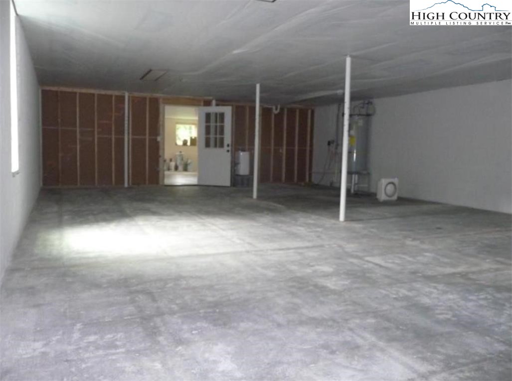 384 New River Heights Road Boone, NC 28607 - Photo 35 of 45 an empty room with windows