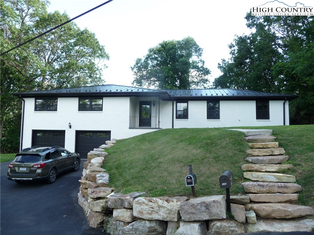 384 New River Heights Road Boone, NC 28607 - Photo 38 of 45 a house view with a garden space