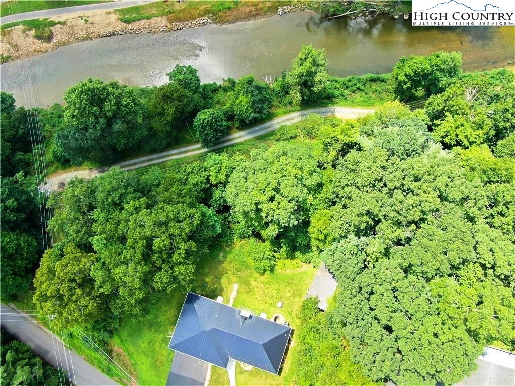 384 New River Heights Road Boone, NC 28607 - Photo 45 of 45 an aerial view of residential house with outdoor space and lake view