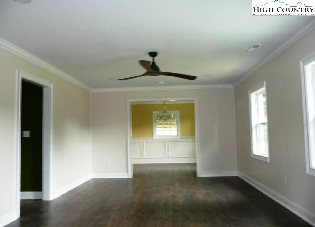 384 New River Heights Road Boone, NC 28607 - Photo 5 of 45 a view of empty room with window
