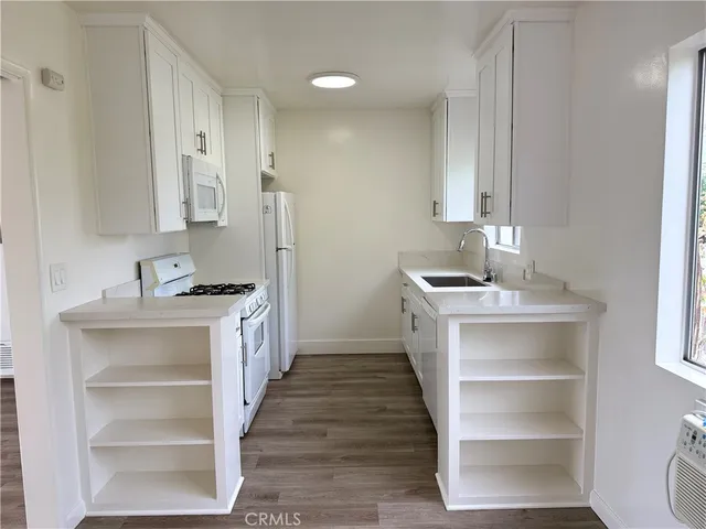 a utility room with cabinets
