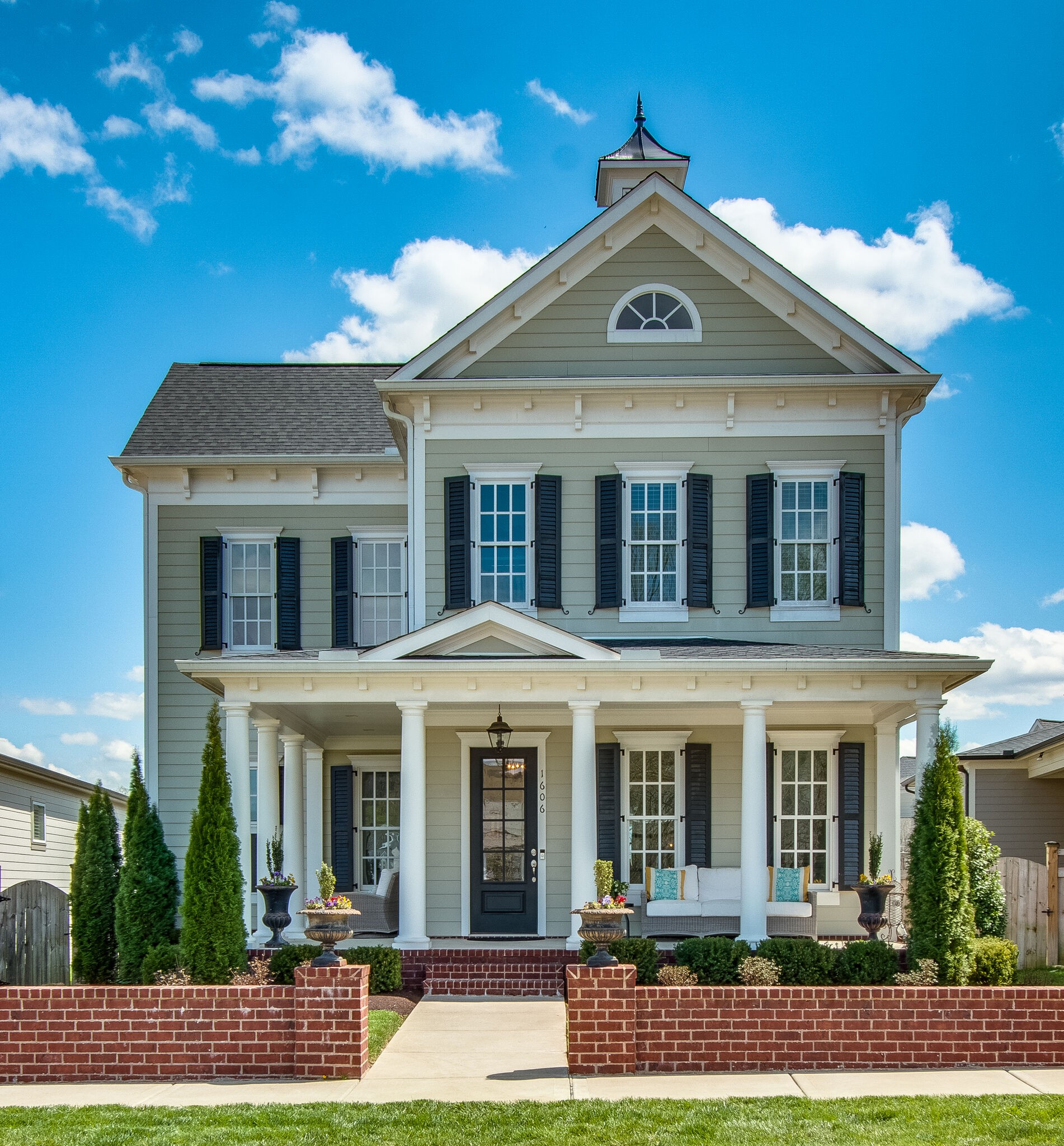a front view of a house with garden