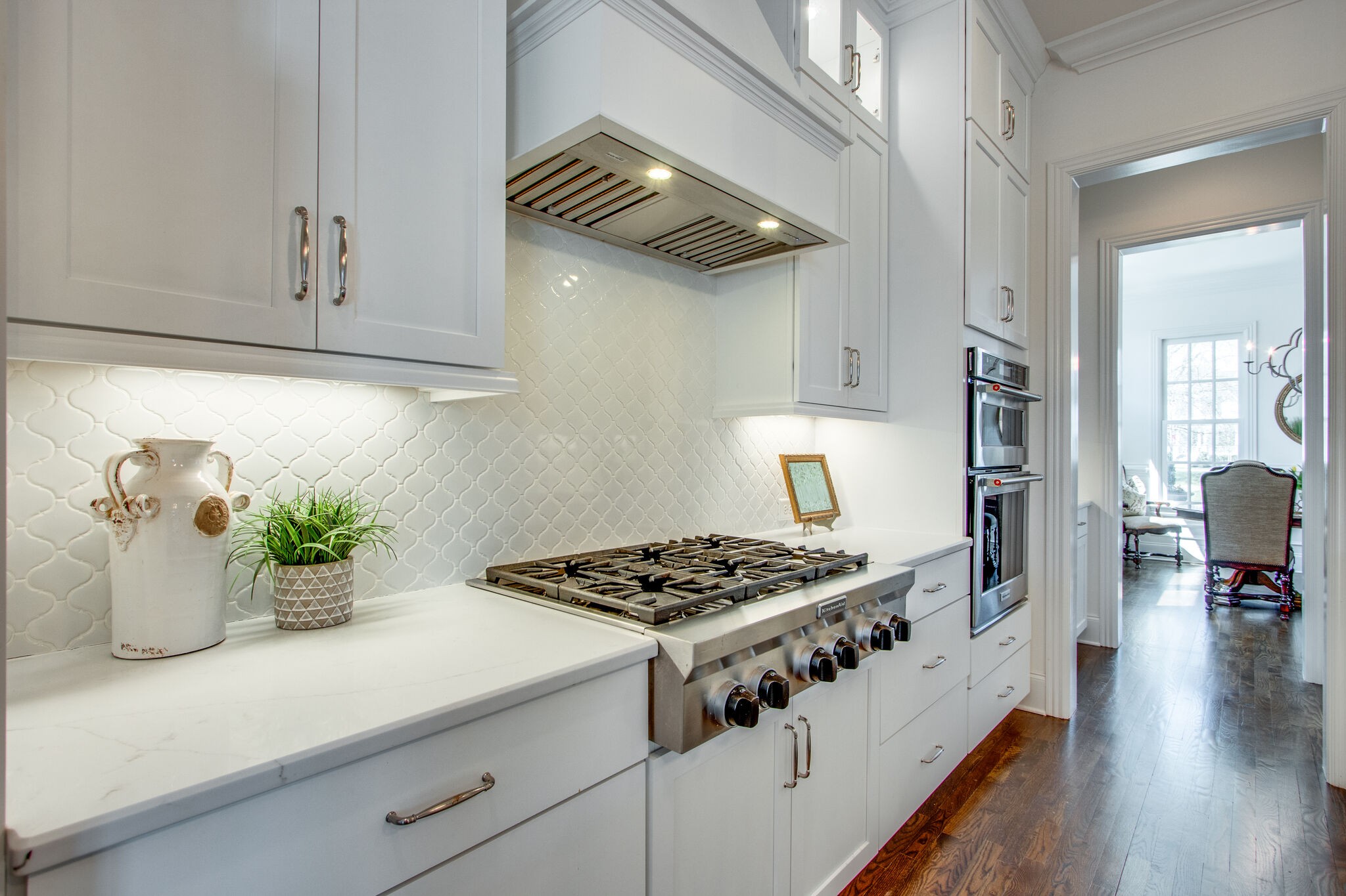 1606 Eliot Road Franklin, TN 37064 - Photo 19 of 67 a kitchen with a stove and a wooden floor