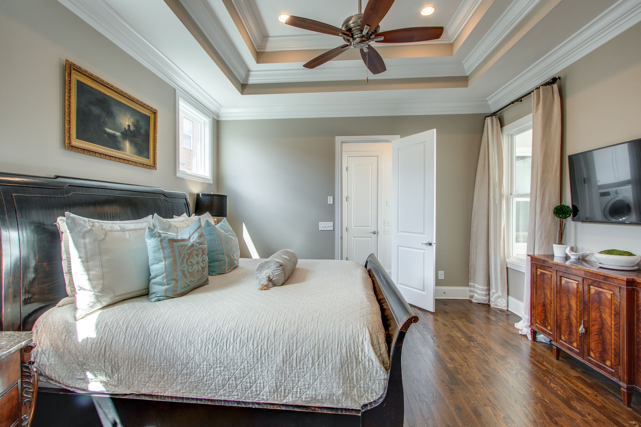 1606 Eliot Road Franklin, TN 37064 - Photo 29 of 67 a bedroom with a large bed a flat tv screen and dresser