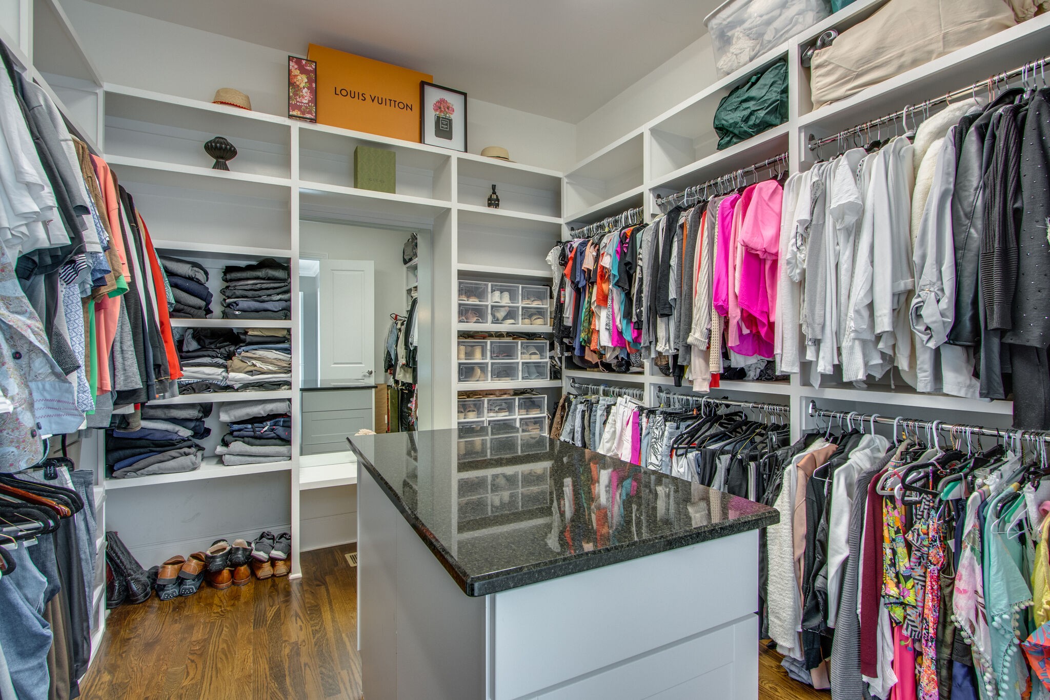 1606 Eliot Road Franklin, TN 37064 - Photo 34 of 67 a view of walk in closet with clothes and shoes
