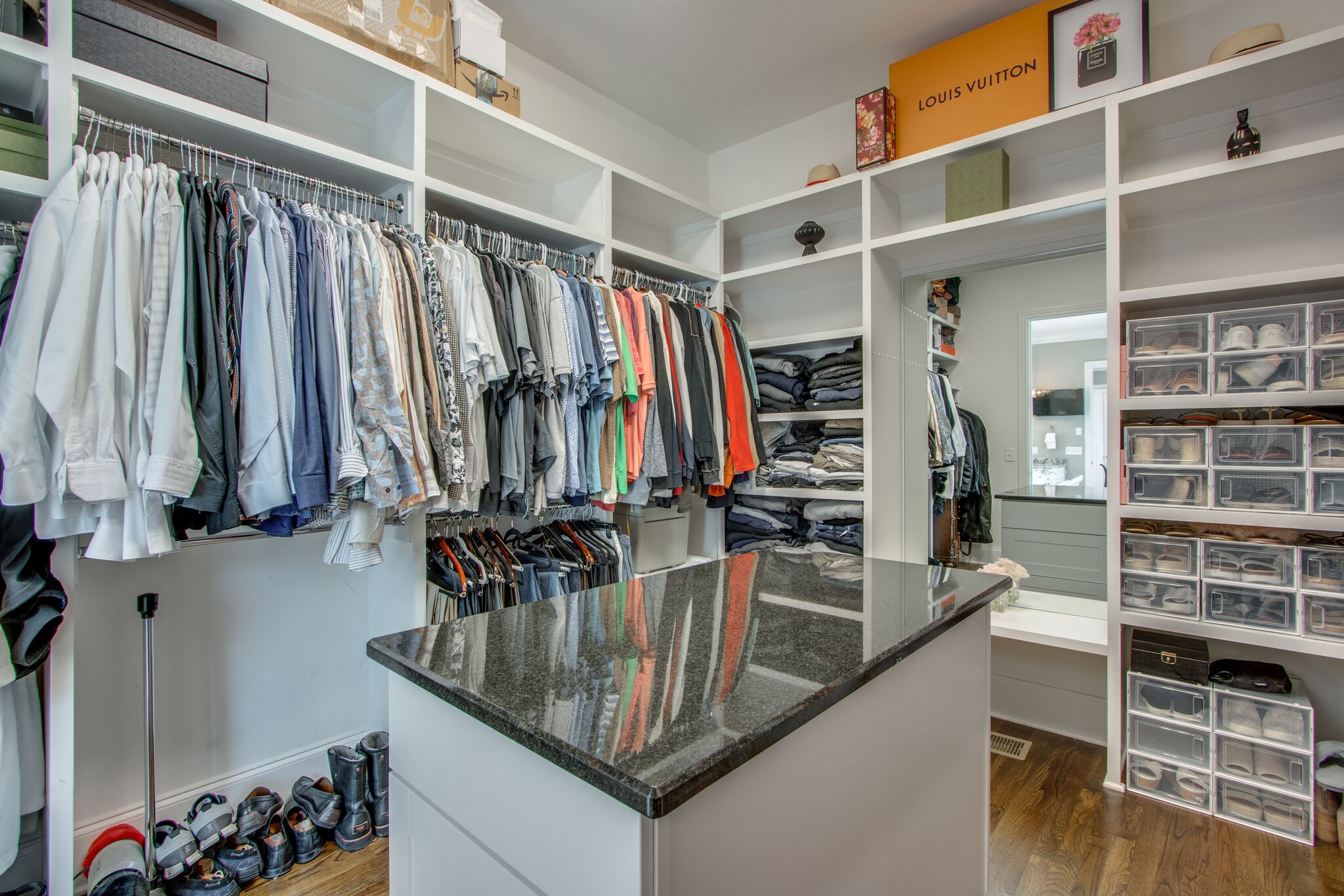1606 Eliot Road Franklin, TN 37064 - Photo 35 of 67 a view of walk in closet with clothes and shoes