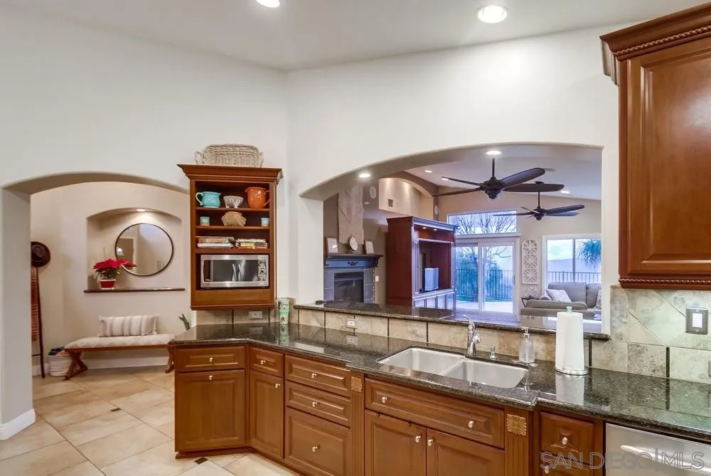 2548 Columbine Road Alpine, CA 91901 - Photo 22 of 71 a kitchen with stainless steel appliances granite countertop a sink and cabinets