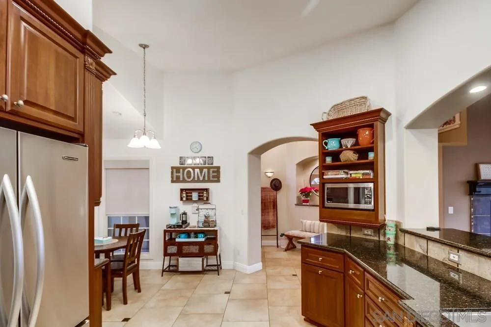 2548 Columbine Road Alpine, CA 91901 - Photo 23 of 71 a kitchen with stainless steel appliances granite countertop a refrigerator and a stove