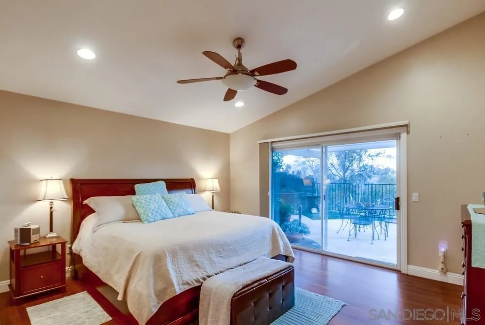 2548 Columbine Road Alpine, CA 91901 - Photo 25 of 71 a bedroom with a large bed and a window