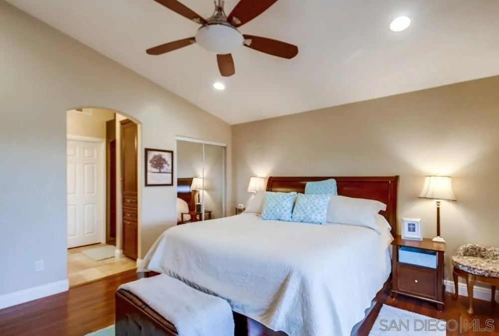 2548 Columbine Road Alpine, CA 91901 - Photo 27 of 71 a bedroom with a bed and wooden floor