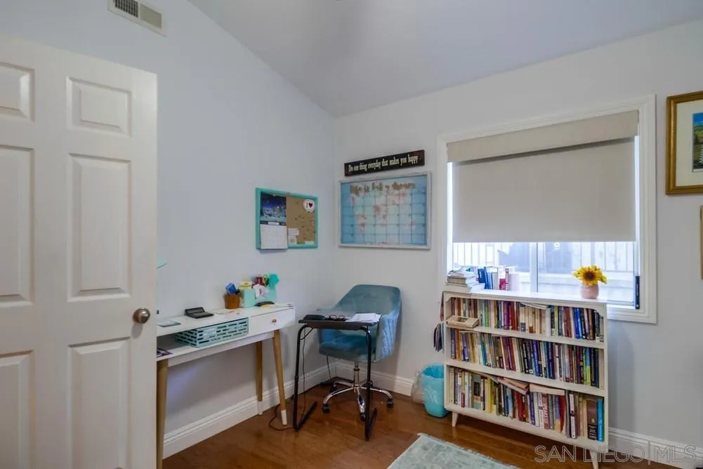 2548 Columbine Road Alpine, CA 91901 - Photo 38 of 71 a room that has a table and a bookshelf