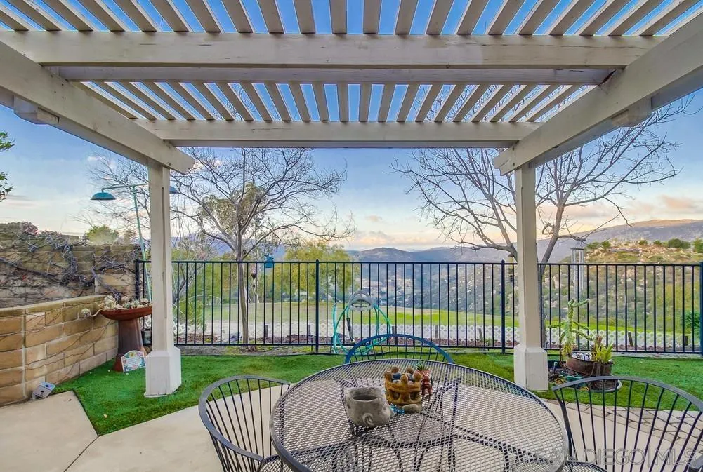 2548 Columbine Road Alpine, CA 91901 - Photo 50 of 71 a view of a roof deck with couches and wooden fence