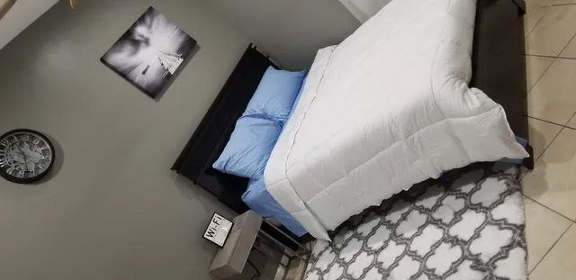 a view of staircase with rug