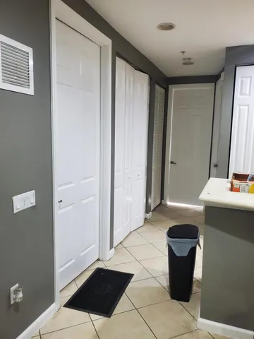 a view of bathroom with a sink and a mirror