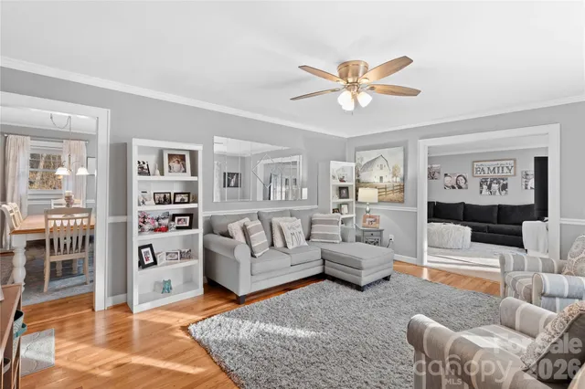 a living room with furniture a view and a rug