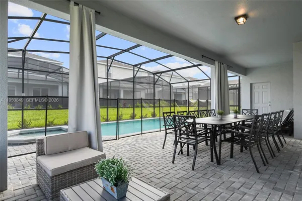 a view of a deck with wooden floor and outdoor seating