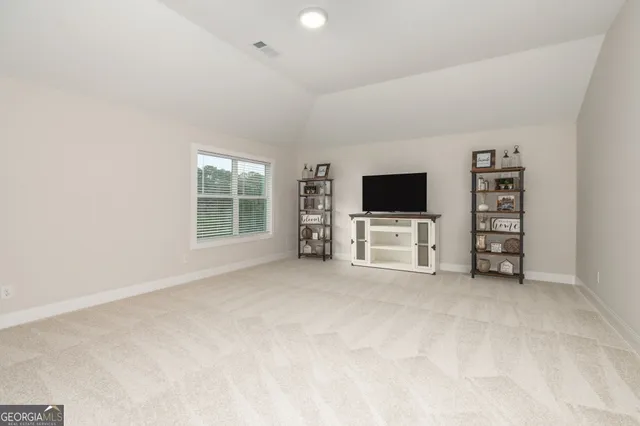 a view of a house with backyard and porch