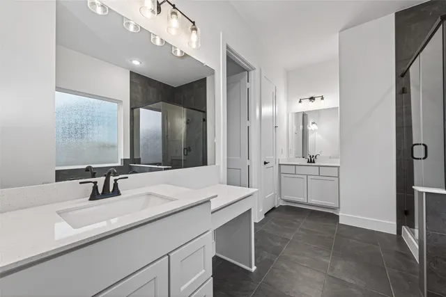 a bathroom with a sink double vanity and a mirror
