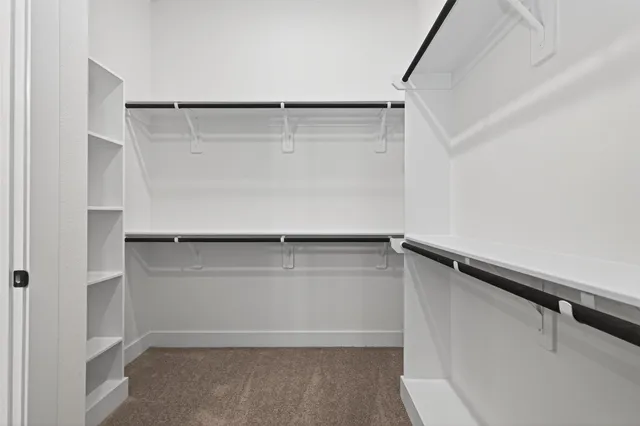 a view of an empty walk in closet
