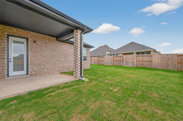 a view of a backyard with a garden and plants