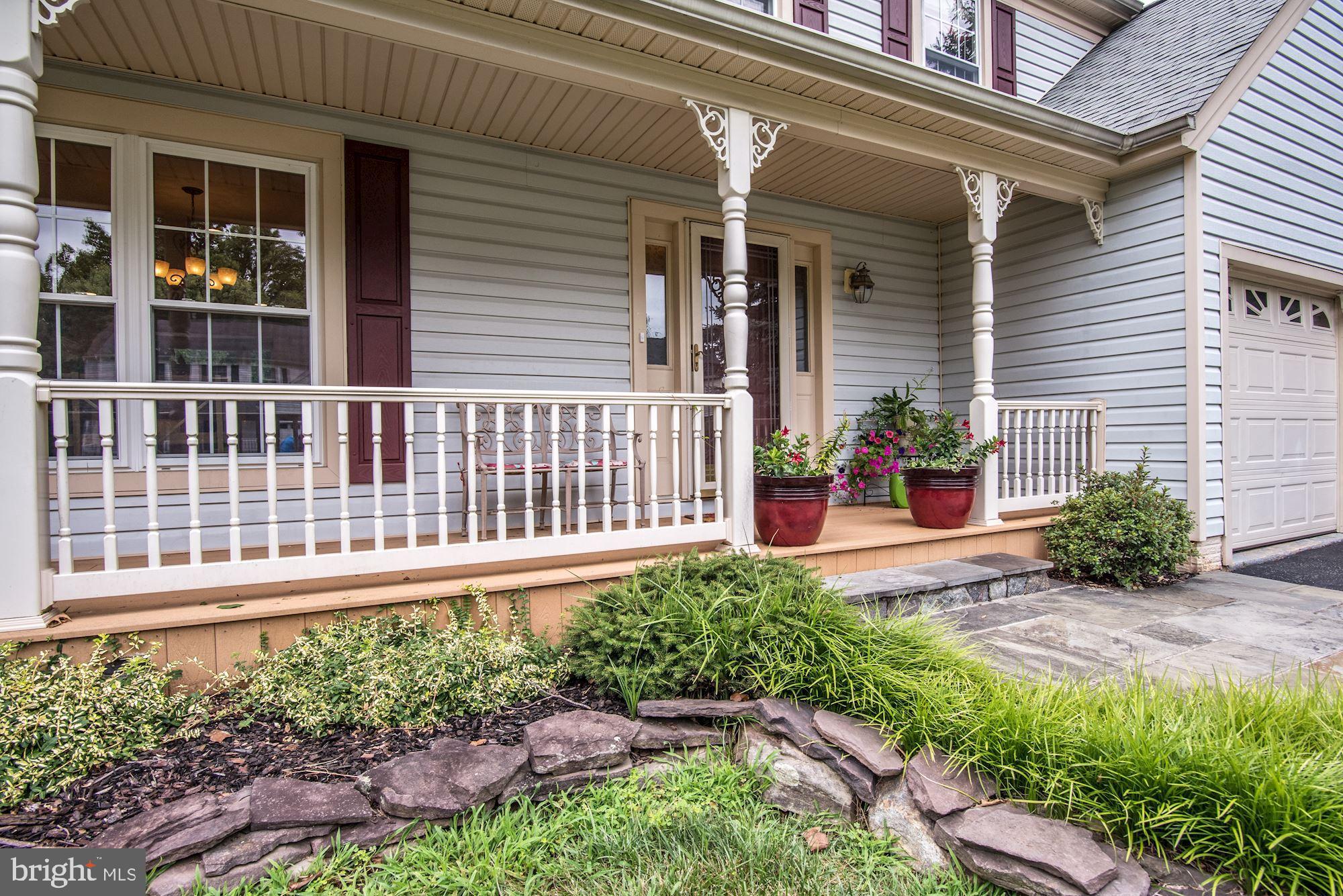 23612 Dixie Ridge Court Gaithersburg, MD 20882 - Photo 30 of 38 Covered Front Porch | Extensive Hardscape