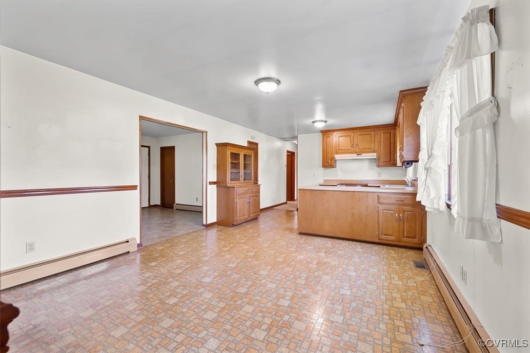 191 Petersburg Road Powhatan, VA 23139 - Photo 20 of 35 Kitchen with a baseboard heating unit, a sink, and