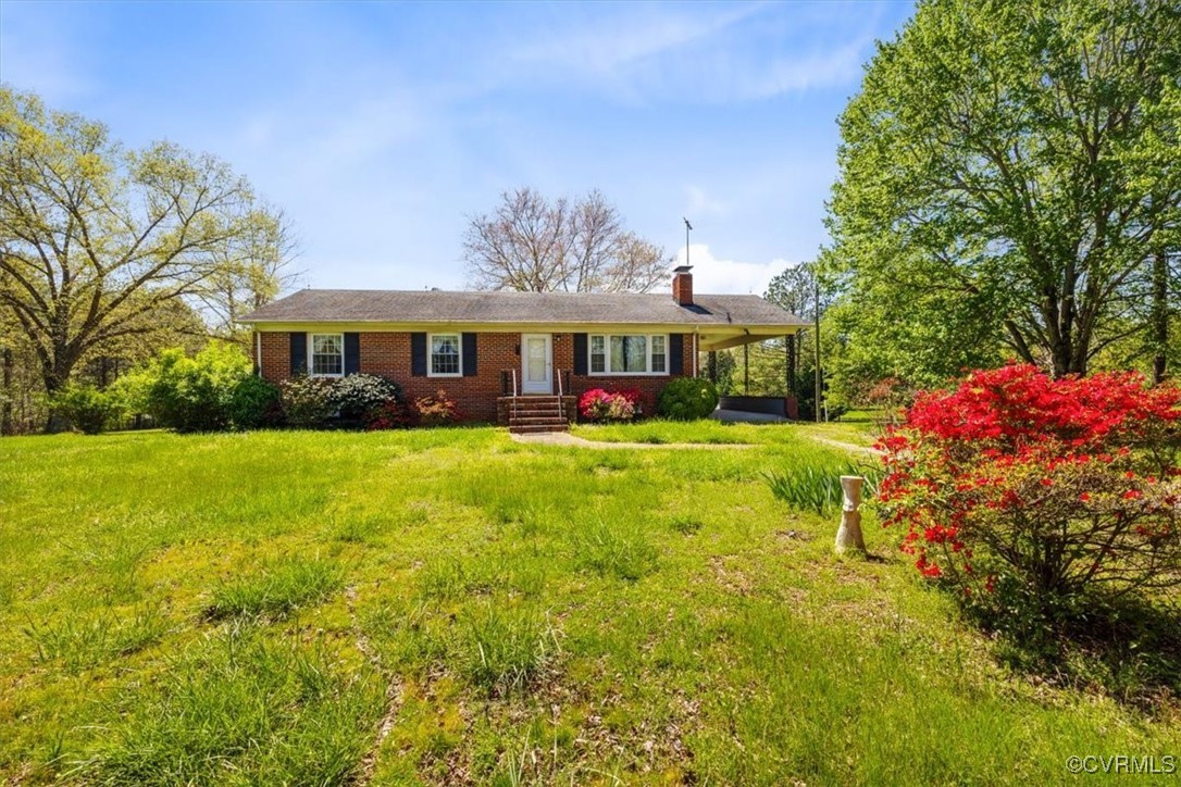 191 Petersburg Road Powhatan, VA 23139 - Photo 2 of 35 Ranch-style house featuring brick siding, a chimne