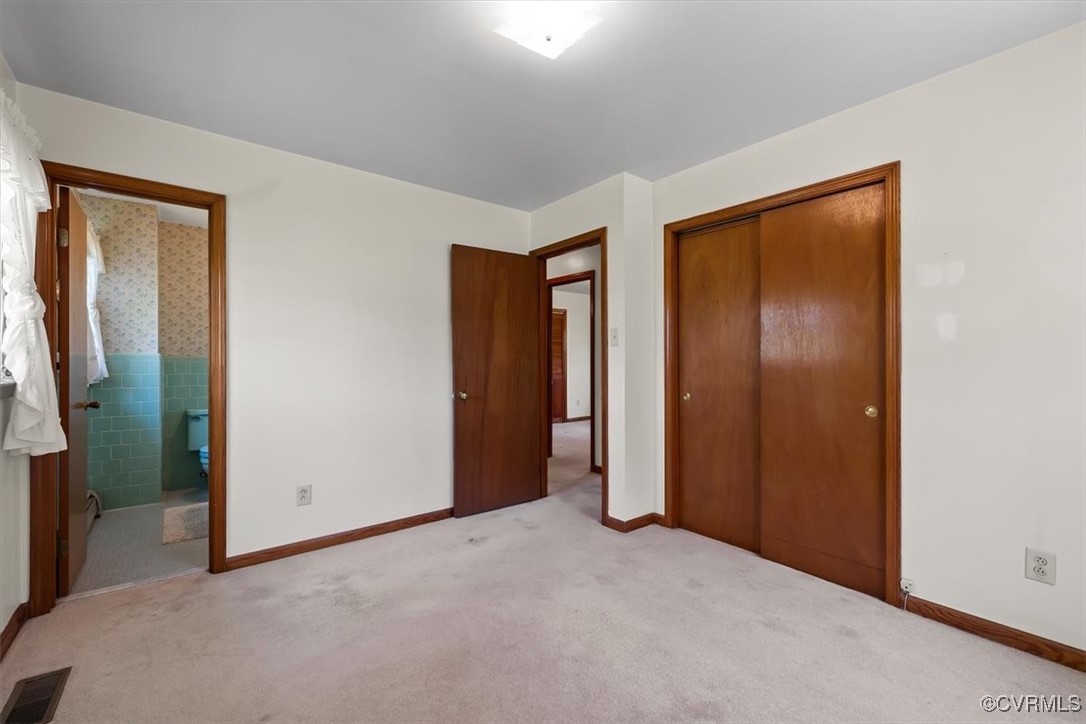 191 Petersburg Road Powhatan, VA 23139 - Photo 21 of 35 Unfurnished bedroom featuring a closet, carpet flo