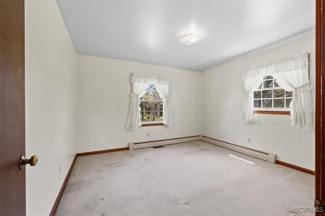 191 Petersburg Road Powhatan, VA 23139 - Photo 25 of 35 Carpeted spare room with baseboard heating, basebo