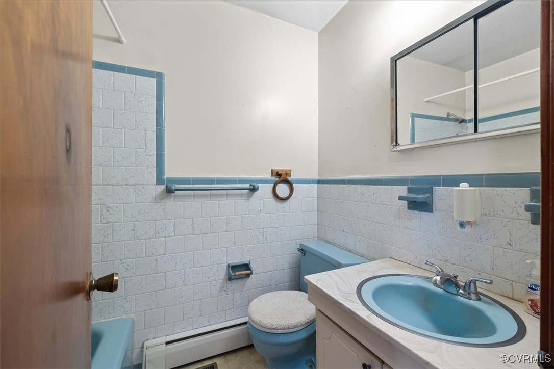 191 Petersburg Road Powhatan, VA 23139 - Photo 26 of 35 Bathroom featuring toilet, vanity, tile walls, wai