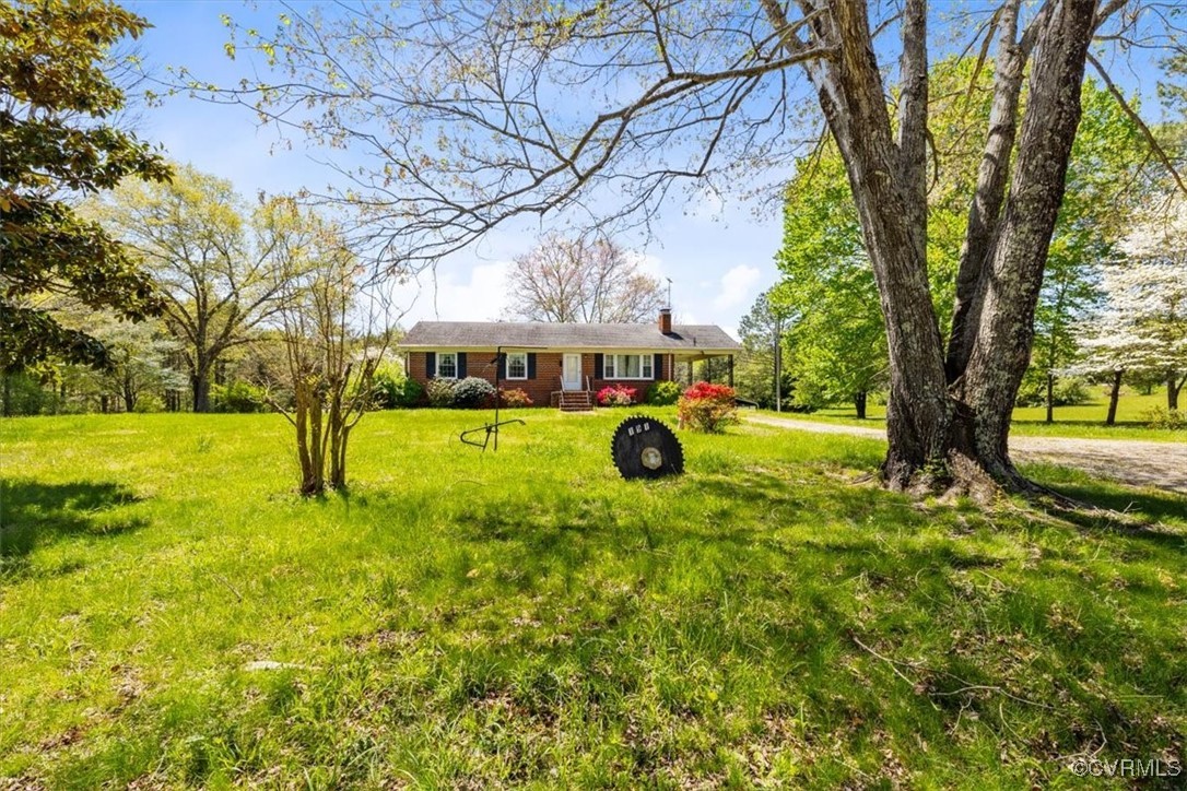 191 Petersburg Road Powhatan, VA 23139 - Photo 31 of 35 Single story home with a front lawn and a chimney