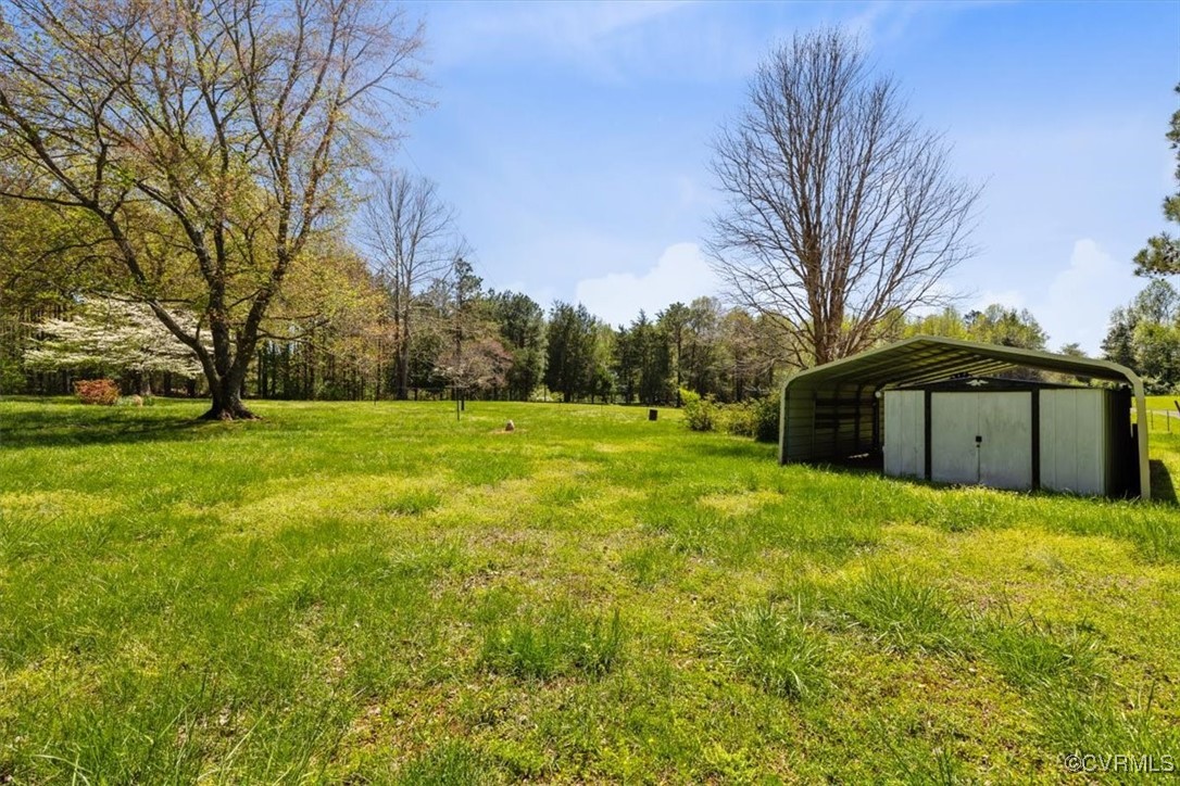 191 Petersburg Road Powhatan, VA 23139 - Photo 10 of 35 View of yard with a carport