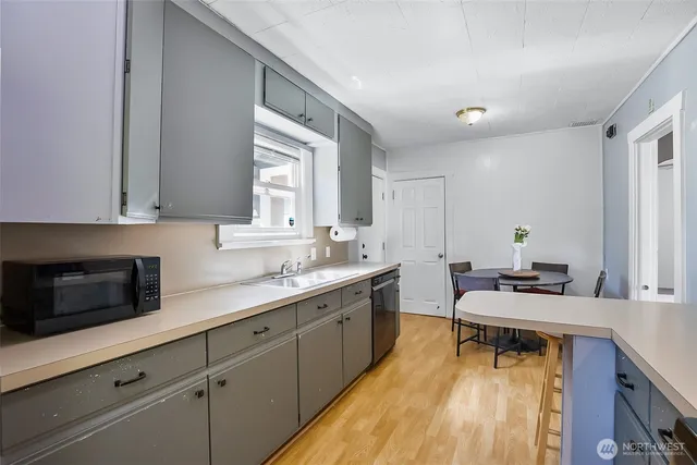a kitchen with a sink and cabinets