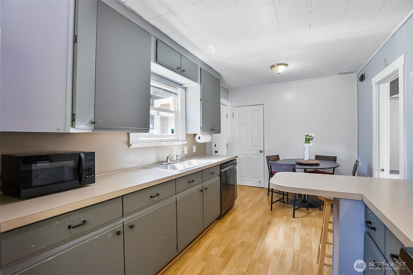 3503 Rockefeller Avenue Everett, WA 98201 - Photo 13 of 36 a kitchen with a sink and cabinets