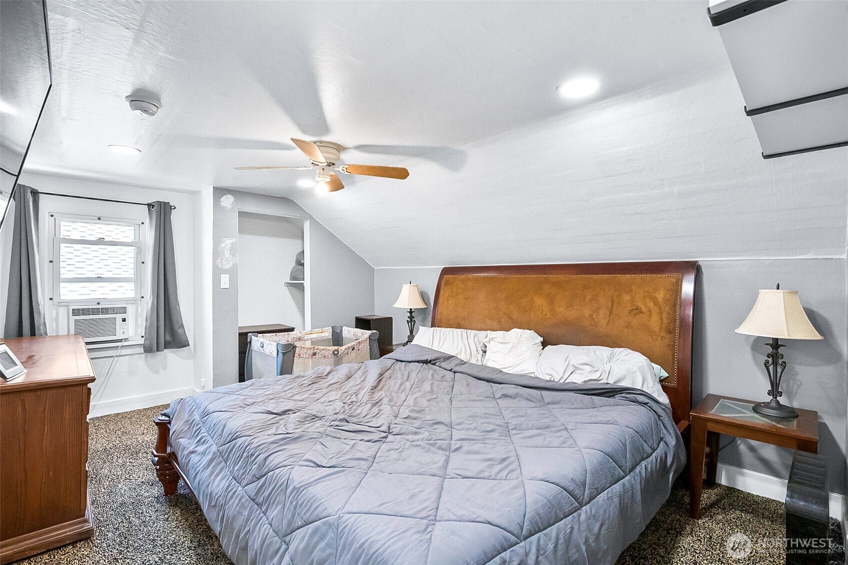3503 Rockefeller Avenue Everett, WA 98201 - Photo 14 of 36 a bedroom with a bed and wooden floor