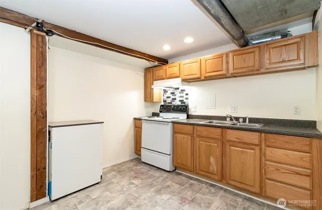 a kitchen with stainless steel appliances a refrigerator and cabinets